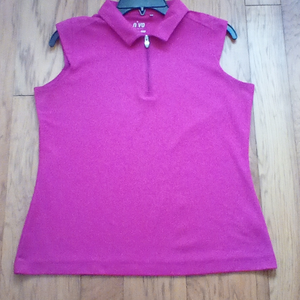 Nivo ladies golf shirt very good used condition. Size m/m fuchsia color.